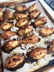 Chicken wings roasted to handsome golden brown on sheet pan lined with parchment paper