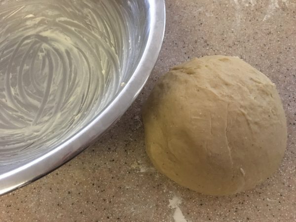 Dough for my King Cake, all mixed up and kneaded well, ready to go in the adjoining big bowl, generously greased with butter, to rise in a warm place.