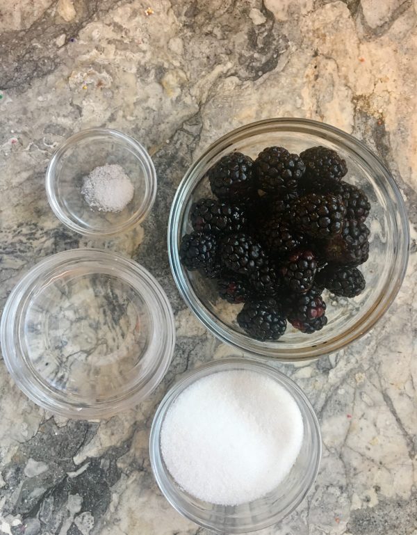 Blackberries ready to get transformed into a luscious berry sauce, with sugar, water, and slat. And heat!